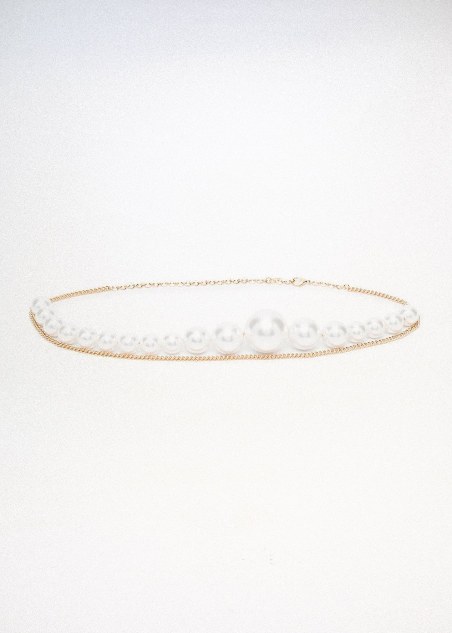 Asymmetric pearl chain belz